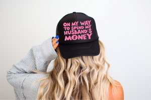 On My Way To Spend My Husbands Money DTF Printed on Foam Black Trucker Hat