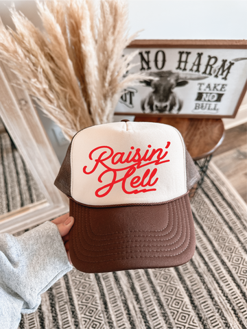 Raisin Hell DTF on a Brown and Tan Hat