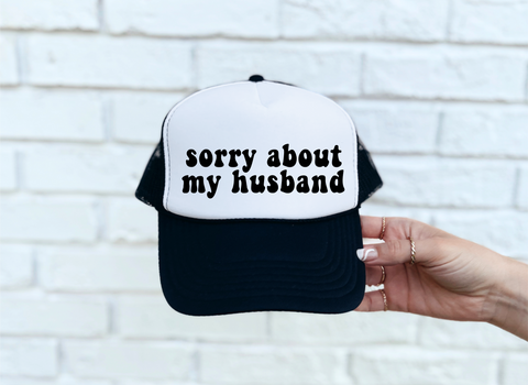 Sorry About My Husband DTF Printed Black & White Trucker Hat all lower case letters