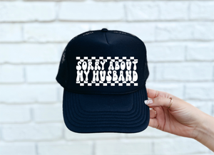 Sorry About My Husband DTF Printed Black Trucker Hat/White Text CHECKERED DESIGN